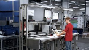 Worker using an ergonomic Bosch Rexroth Workstation
